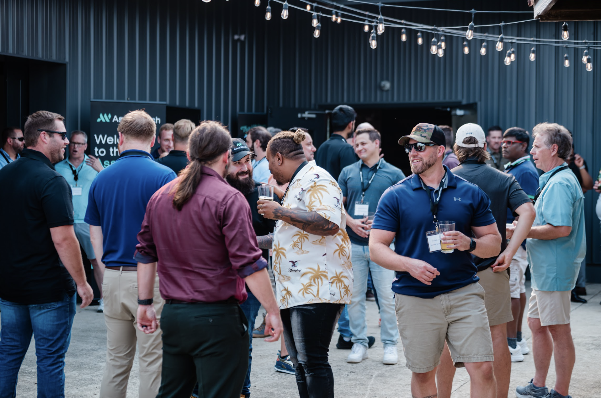 Group of people talking and socializing during happy hour at Retreat 21 near Columbus, Ohio